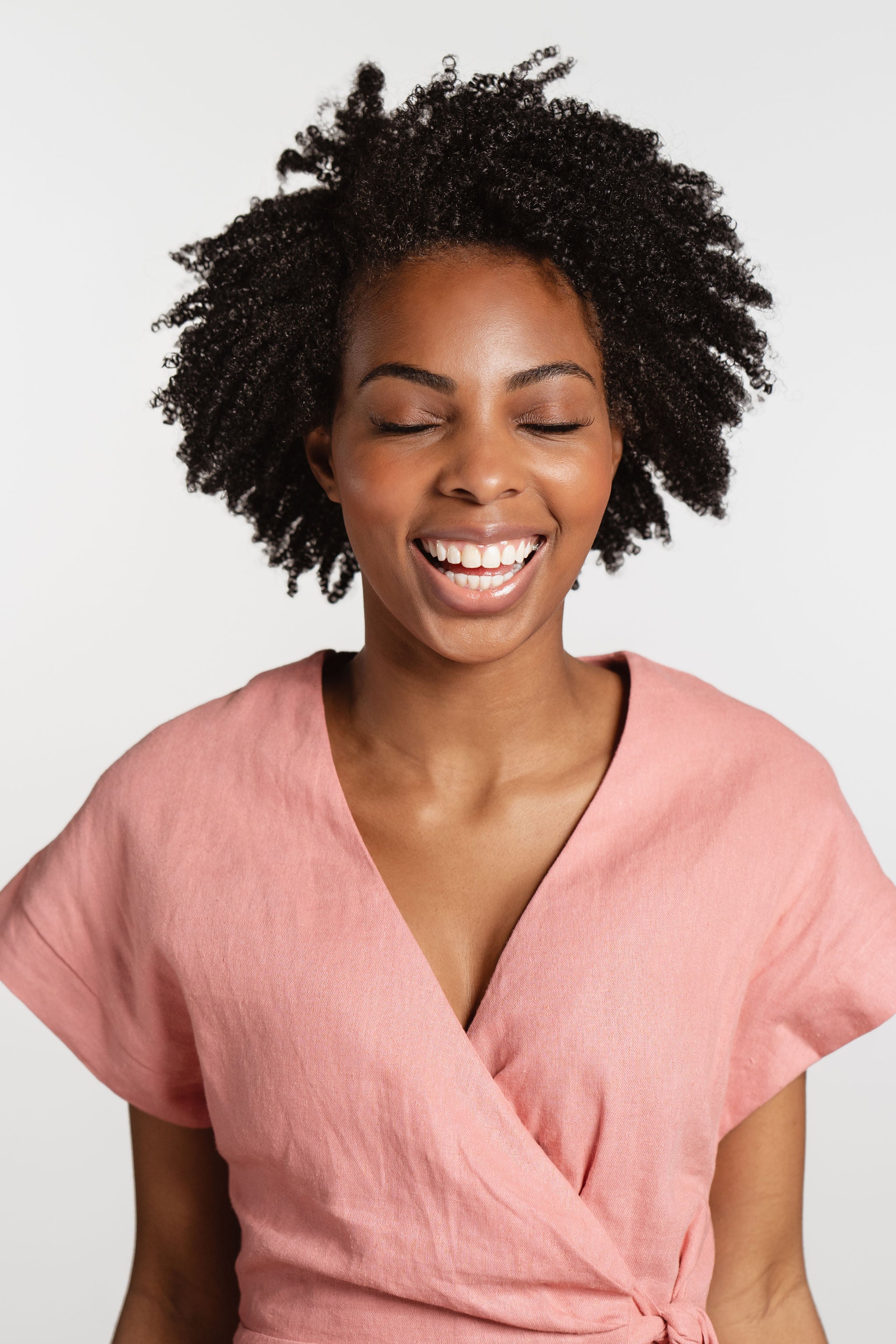 Natural hair products on tight curly hair to create definition