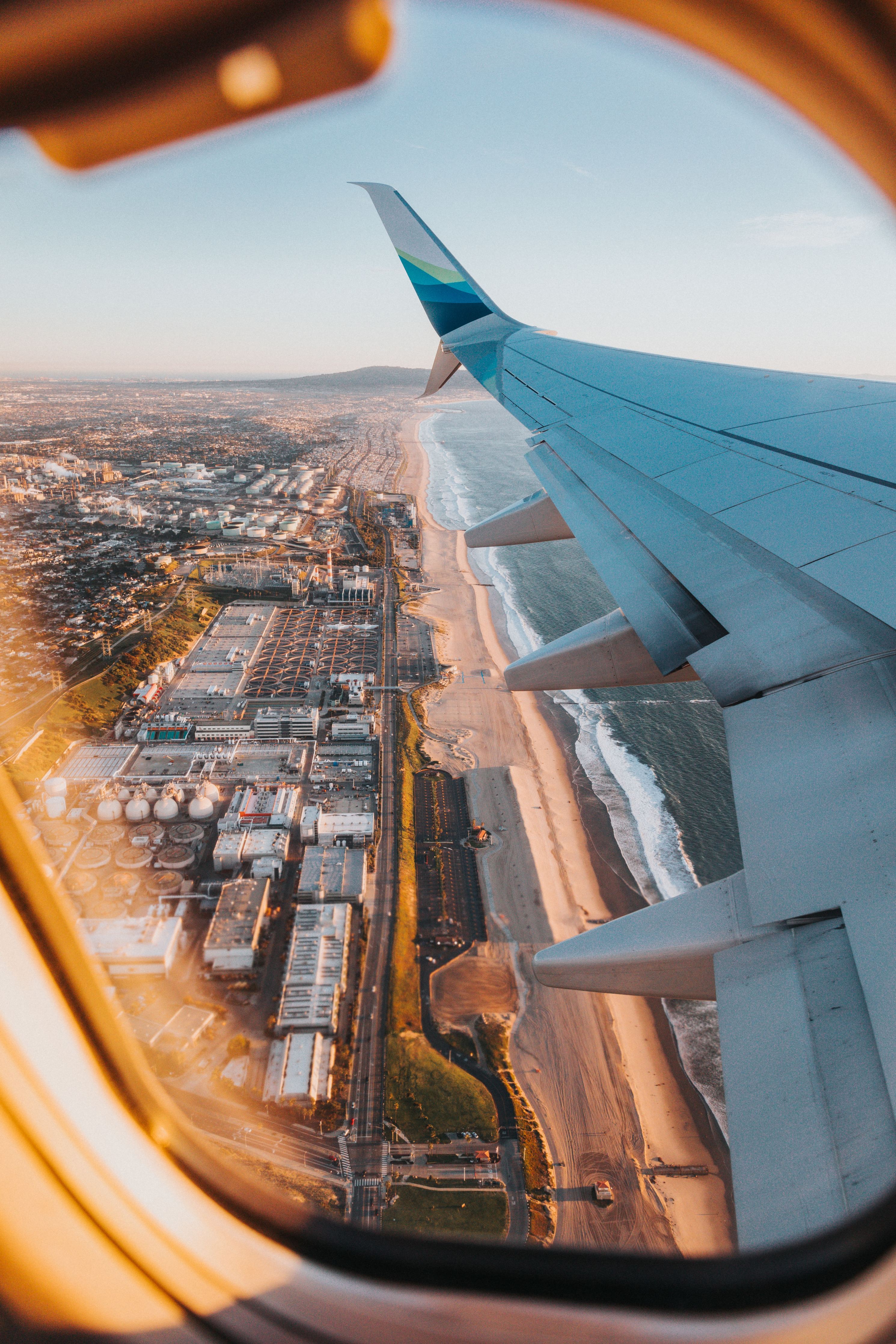 the view from an airplane window, products to take on vacation