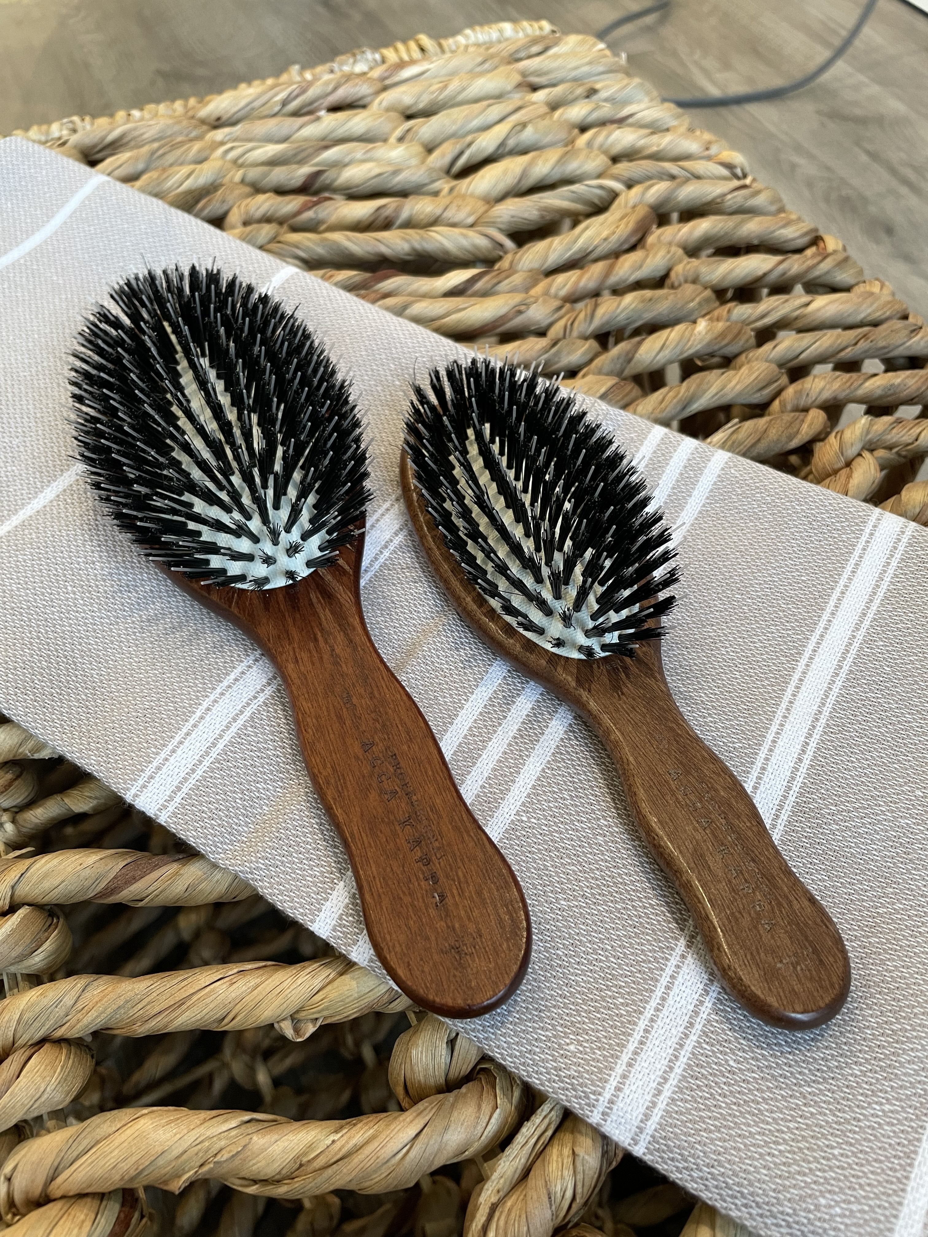 Acca Kappa boar bristle hairbrushes in two sizes, regular and travel, for healthy hair.