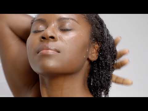 Video on how to detox and repair your scalp and hair naturally - cleany beauty hair tips - cover photo is of a woman enjoying a shower