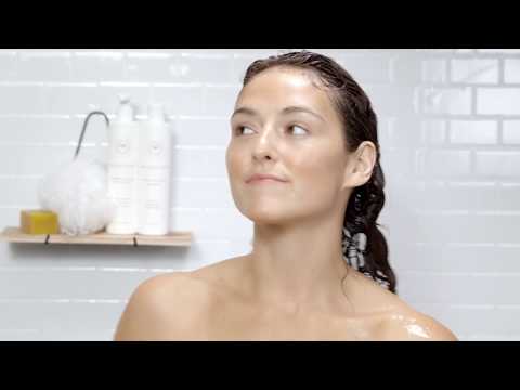 Learn how to use organic shampoo with a holistic hair expert in this demo - cover photo is of a woman in the shower with Innersense organic shampoo and conditioner in the background
